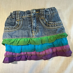 Children’s Place denim skirt with blue, green and purple ruffles. Size 3T.